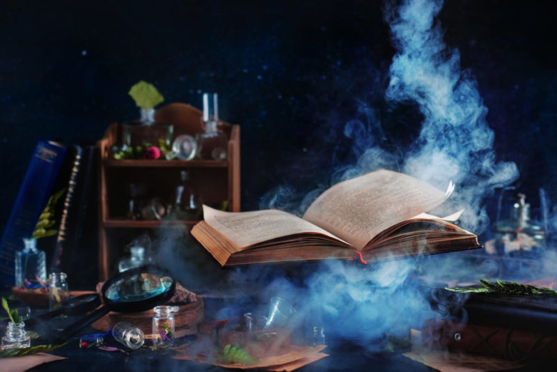 Flying magical book with smoke